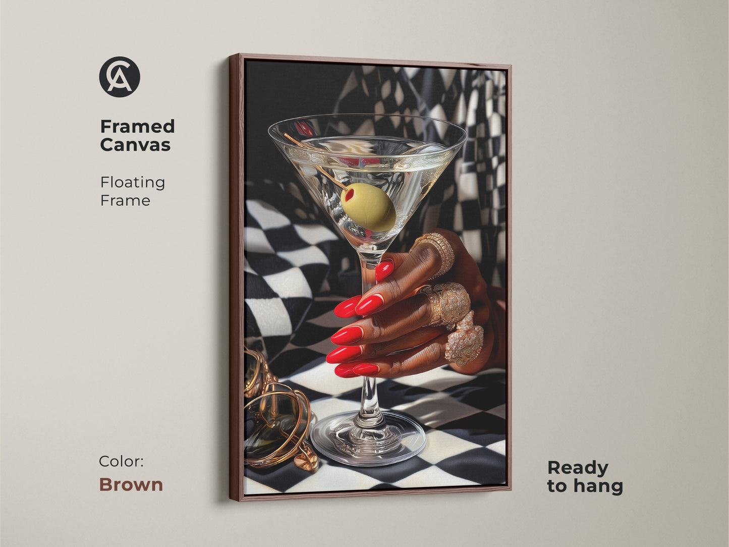 Framed canvas of martini art print with gold jewelry. Art deco artwork featuring red nails and gold rings against a black and white checkered background. Brown floating frame adds contemporary style. Glamorous bar decor for a luxury home bar. Perfect gift for cocktail lovers ready to hang.