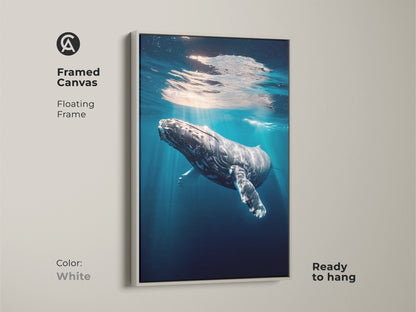 Framed canvas featuring a humpback whale in a white floating frame. This ocean wildlife wall art brings a coastal touch to any space. Ready to hang this realistic underwater scene captures marine life. The deep blue art is perfect for nautical home decor. A stunning ocean photography print.