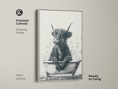 White framed canvas featuring a Highland cow in a bathtub. This floating frame is ready to hang. The black and white artwork complements any color scheme. Perfect for farmhouse bathroom decor. A delightful gift for farm animal lovers. This funny sketch adds charm.