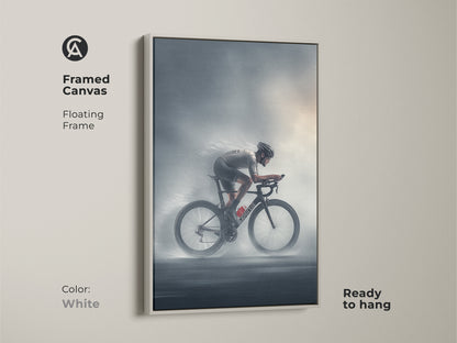 Framed canvas print of a road cyclist rendered in charcoal and silver. It includes a floating frame in white. This minimalist sports decor is ready to hang. Perfect for contemporary cycling enthusiasts and athletic home decor. A dynamic addition to any office or gym wall.