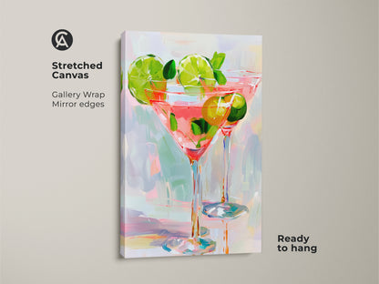 A stretched canvas print shows two vibrant cocktail glasses. Pink liquid and lime garnish complete the piece. The gallery wrap has mirrored edges. It comes ready to hang. This art adds a fun touch to any room.