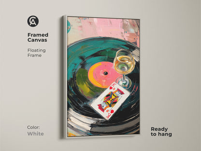 Framed canvas displays abstract vinyl record art. A King of Hearts card print adds a unique accent. The white frame complements the teal and pink colors. This ready-to-hang artwork is perfect for eclectic home decor. Its for music enthusiasts.