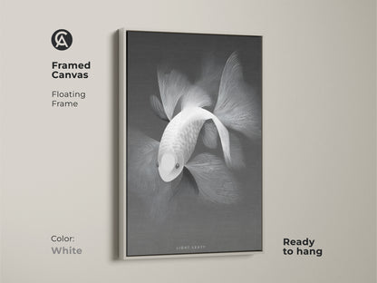 Monochrome fish artwork in a framed canvas. The floating frame is white and complements the art. The canvas is ready to hang. It's a versatile piece for various interior styles. Discover framed canvas prints for stylish home accents.
