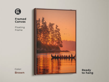 Framed canvas art with a floating frame displaying a beautiful sunset and canoe scene. The brown frame complements the warm tones of the artwork. The reflection of the trees and sky on the water create a stunning visual effect. Ready to hang this piece will enhance any space. Buy framed art online.
