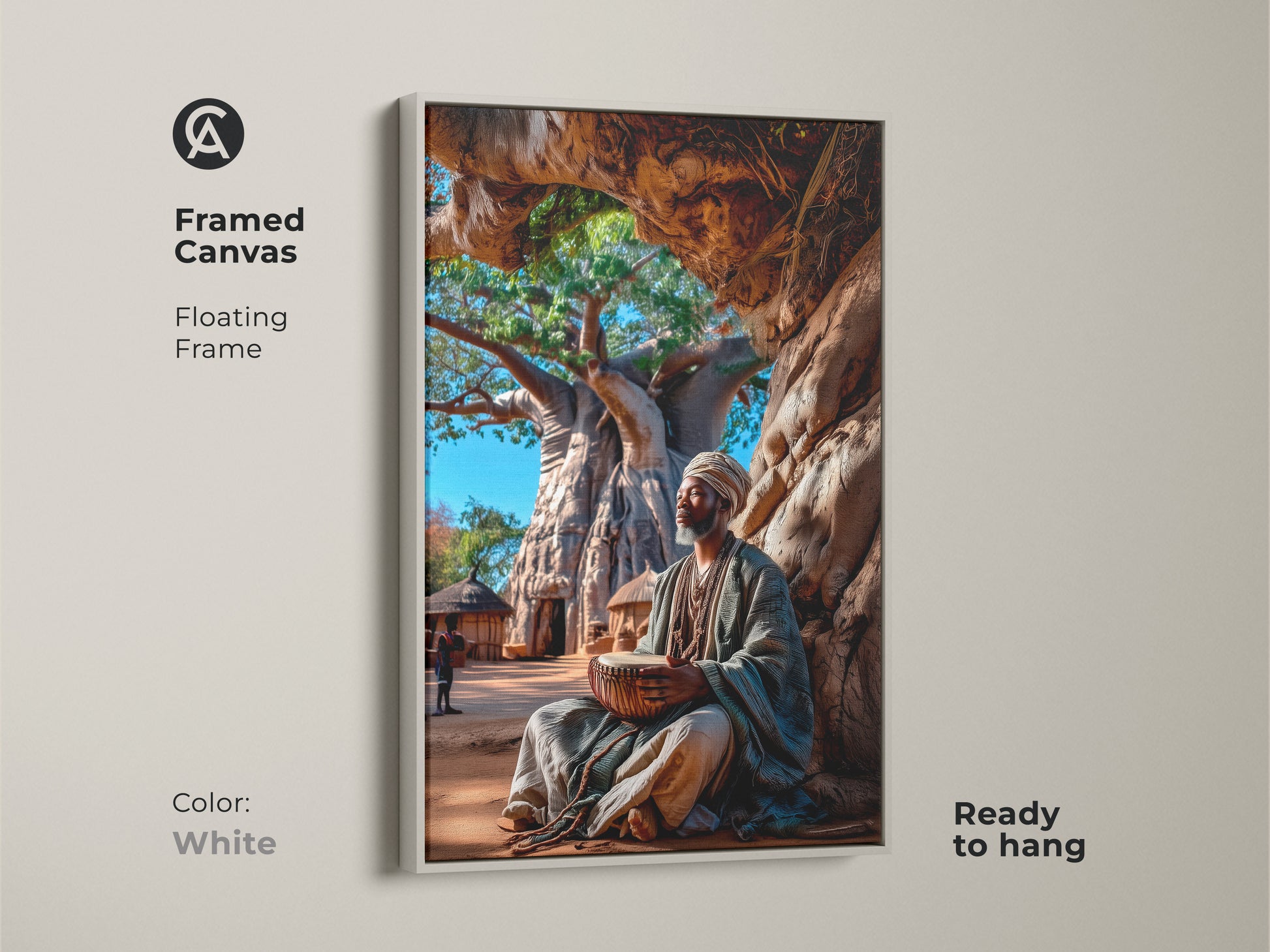 Framed in white this canvas print features an African man drumming. The floating frame offers a clean look and it's ready to hang. The artwork shows an African man under a Baobab tree. Its earth tones complement modern decor.