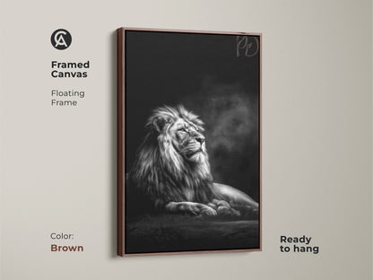 Framed canvas art displays a monochrome lion with a floating brown frame. The regal king of the jungle is captured in photorealistic detail. This black and white animal artwork is ready to hang.