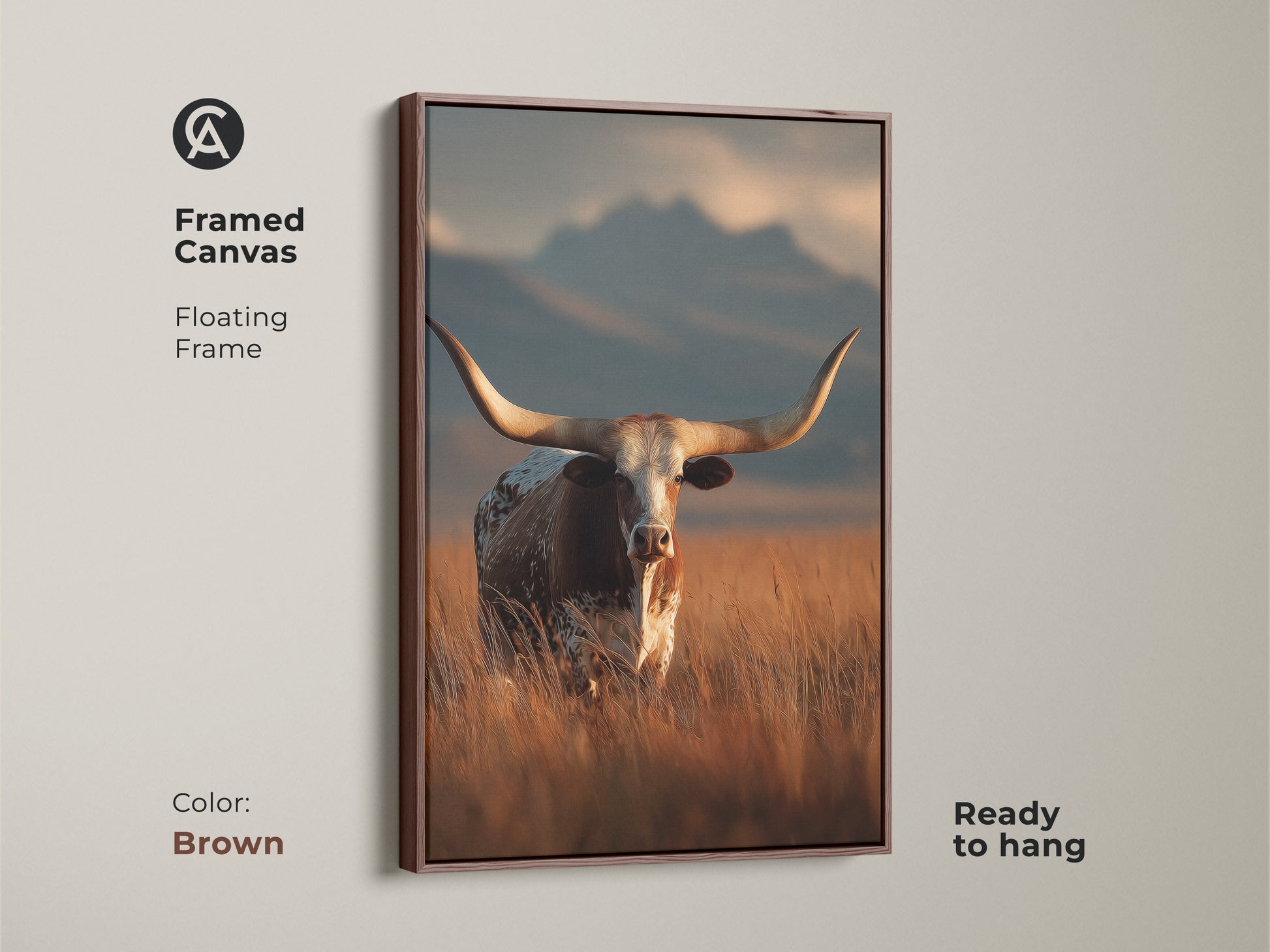 Brown framed canvas of longhorn cattle. This floating frame is ready to hang. The rustic western landscape uses warm earth tones. This farmhouse wall decor captures the beauty of wildlife. This animal art print is perfect for a cowboy ranch style home.