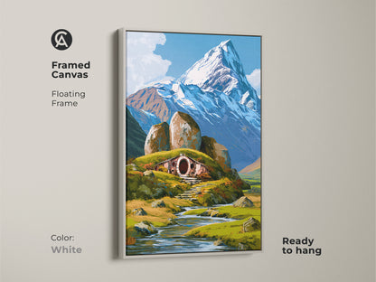 White framed canvas print featuring a hobbit home. The fantasy nature landscape includes a snowy mountain. This illustrative art brings a touch of whimsy to any space. A perfect gift for fantasy fans.