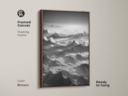 Framed canvas in brown showcases monochrome mountain wall art. Aerial landscape provides a black and white scenic artwork. Floating frame enhances modern bedroom wall art. Serene mountainscape canvas suits contemporary decor. Ideal outdoor adventure wall art.