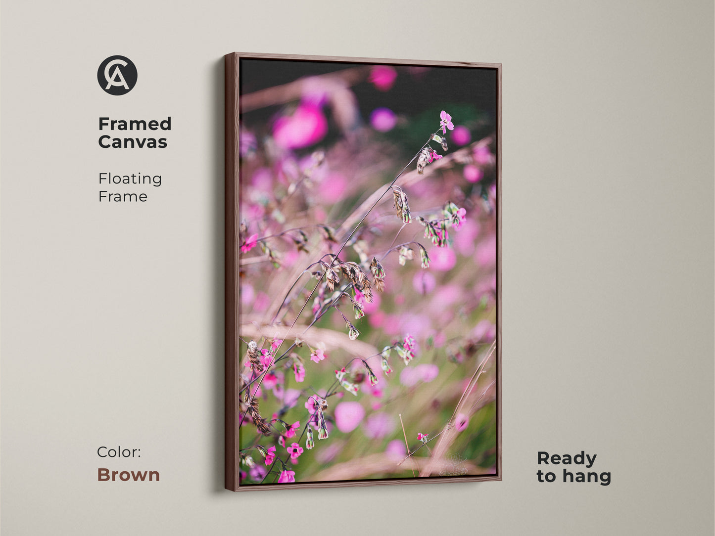 Framed canvas featuring soft focus nature art. The pink wildflower macro photo has a floating frame in brown. This botanical art print is ready to hang. Its boho aesthetic makes it ideal as bedroom wall decor.