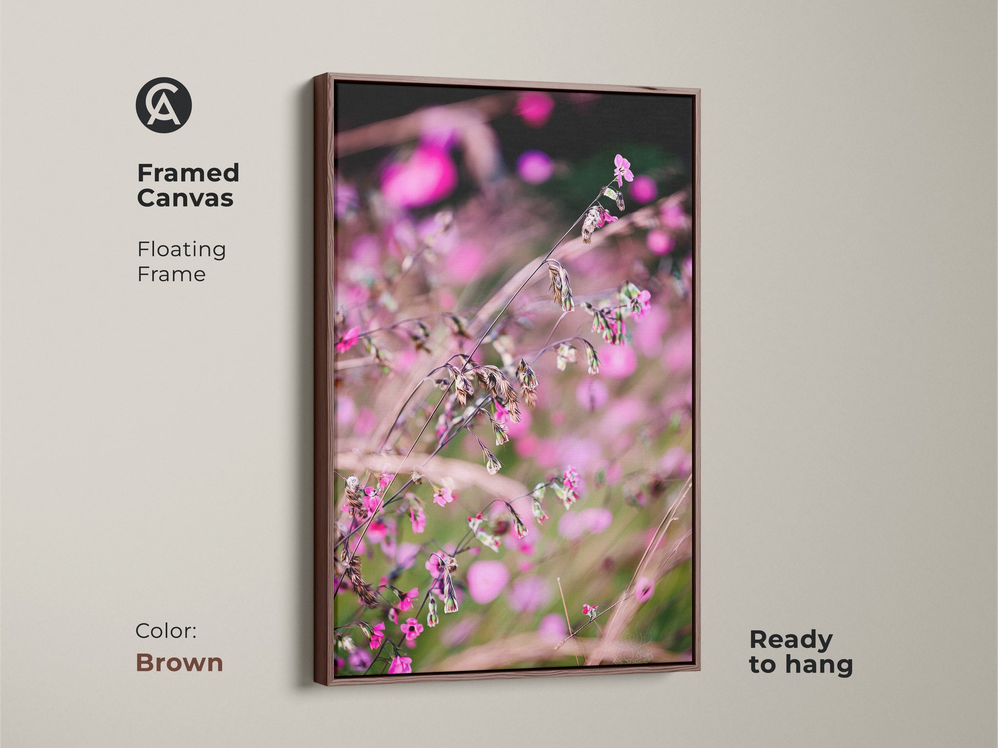 Framed canvas featuring soft focus nature art. The pink wildflower macro photo has a floating frame in brown. This botanical art print is ready to hang. Its boho aesthetic makes it ideal as bedroom wall decor.