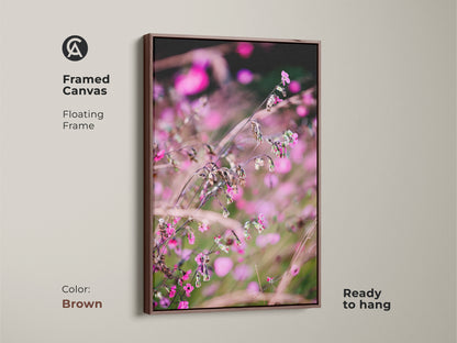 Framed canvas featuring soft focus nature art. The pink wildflower macro photo has a floating frame in brown. This botanical art print is ready to hang. Its boho aesthetic makes it ideal as bedroom wall decor.