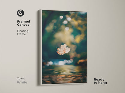 Framed canvas art with floating frame in white. The artwork features a single leaf above water. Ready to hang and easy to install. The white frame offers a clean modern look. Perfect home accent.