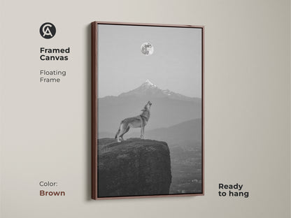 Brown framed canvas showcasing a wolf howling at the moon. Unique animal art print for nature lovers. Celestial mountain art is ready to hang.