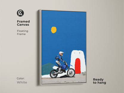 Framed canvas featuring Motocross Rider artwork. A floating white frame enhances the print. The Yamaha dirt bike art is for off-road adventure decor. The blue yellow landscape art is minimalist. Ready to hang in any space.