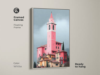 Framed canvas in white displays a pink church tower art print. Floating frame complements European village artwork. Italian architecture painting adds elegance to travel decor.