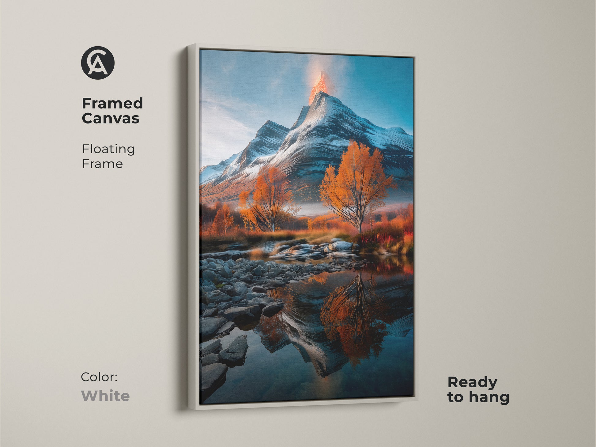 Framed canvas of a snowy volcano mountain landscape with orange autumn trees. White floating frame enhances its scenic vista. Ready to hang and perfect for cozy bedroom decor. River reflection artwork is a nature lover gift idea. This scenic print adds a touch of rustic charm.