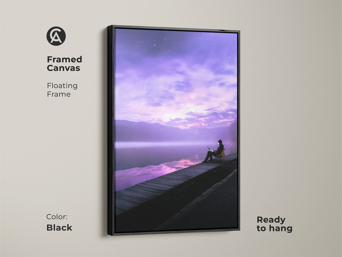 Framed canvas of a surreal person working on a laptop by a lake. This modern art piece features a floating frame in black. The violet skyscape enhances this dreamy dock scene print. Ready to hang. Ideal wall art for a modern office or study room.