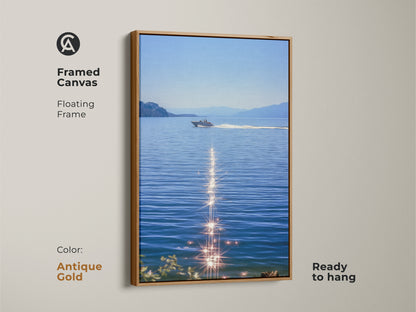 Antique gold framed canvas featuring a boat on blue water. The sparkling ocean artwork displays a realistic lake landscape. This ready to hang piece will enhance coastal bedroom wall decor for boat lovers. Summer water scene art as nautical home decor. Modern boat artwork for calm spaces.