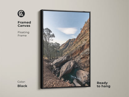Framed canvas art of a Rocky Mountain landscape with a black floating frame. This rustic wall decor features sky blue nature photography and gnarled trees. Ready to hang this is a perfect hiker gift. Enhance your space with this scenic mountain view.