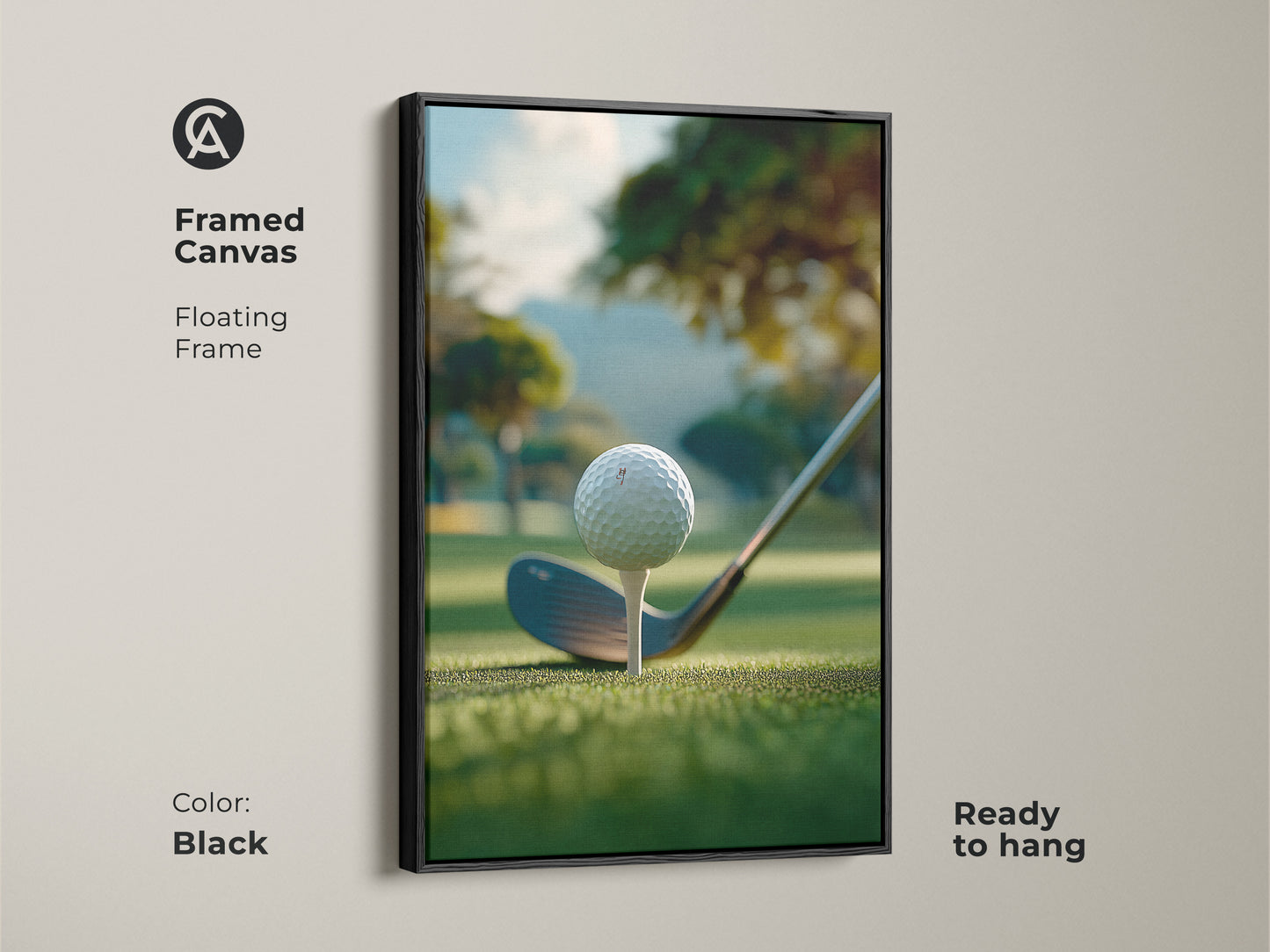 A black framed canvas golf art print ready to hang. The artwork shows a golf ball on a tee ready to be hit. The background is a green golf course with trees and a hill. This framed golf art print is perfect for your home or office.