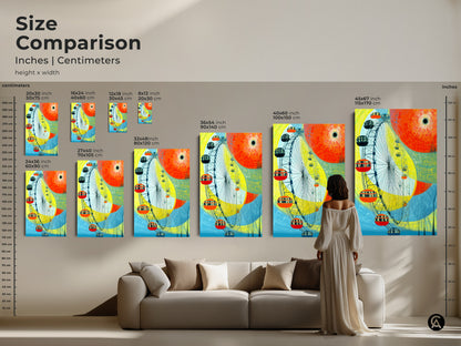 A size comparison showcasing abstract Ferris wheel artwork in various dimensions. See how the canvas art and poster prints fit above a sofa. Visualize the impact of different sizes of this yellow orange and blue modern cityscape. Perfect for adding vibrant city art to any room.