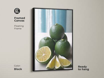 Framed canvas with a floating frame showcasing a green lime still life. The black frame enhances this modern minimalist kitchen decor. This botanical citrus fruit artwork is ready to hang.