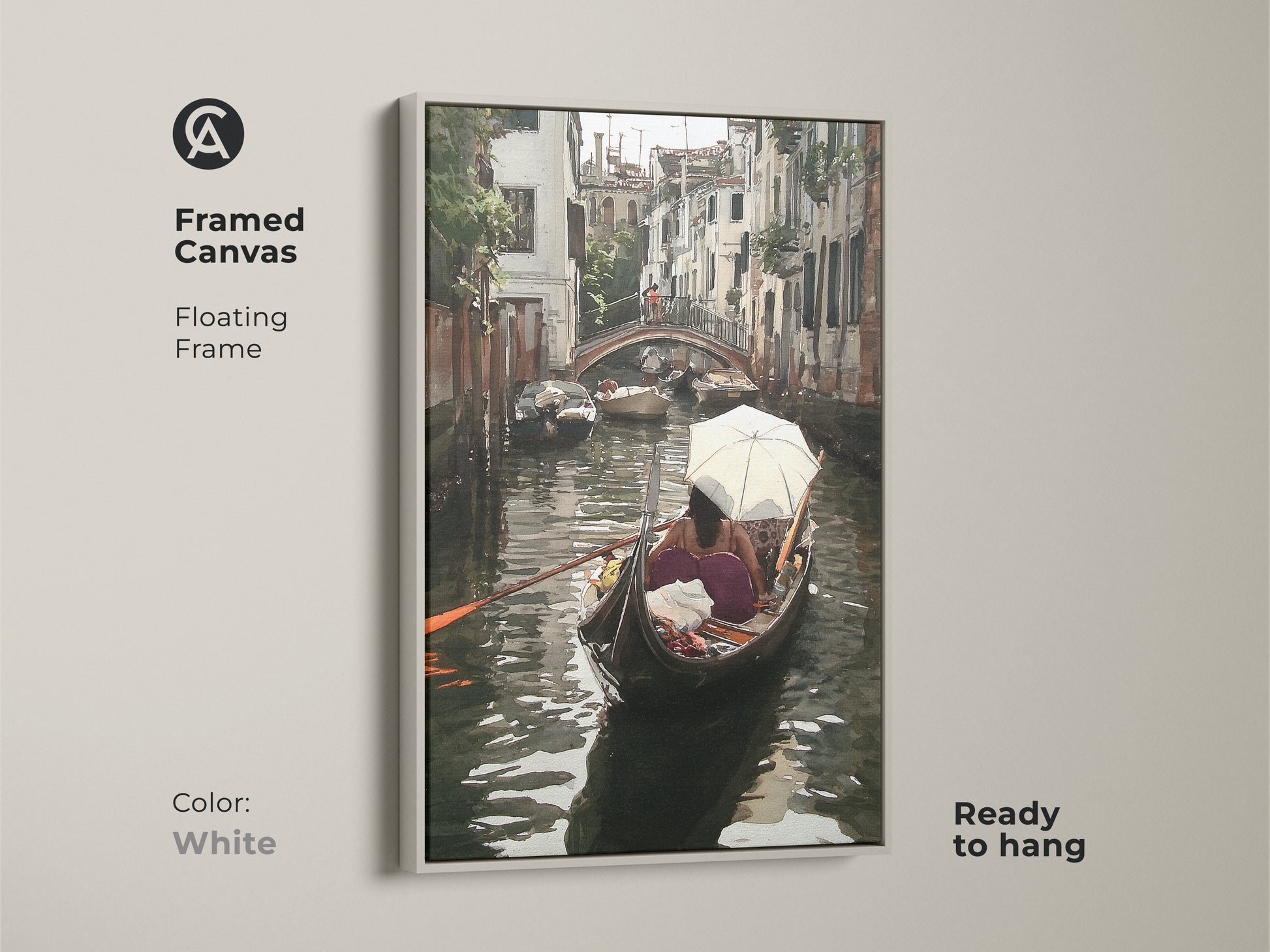 Framed canvas featuring a Venice canal watercolor artwork. This Italian cityscape wall art has a floating white frame and is ready to hang. The teal and brown artwork depicts a gondola boat scene ideal for boutique hotel art or unique cityscape artwork.