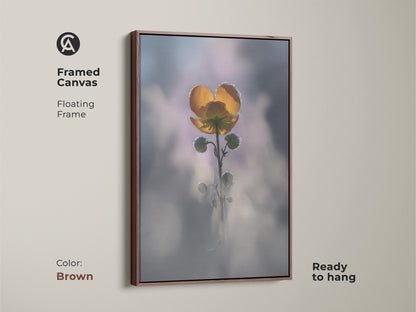 Brown framed canvas of a yellow buttercup. Floating frame adds elegance to this macro nature photography. Soft focus botanical wall art is ready to hang. Boho bedroom nature decor makes a great plant lover housewarming gift.