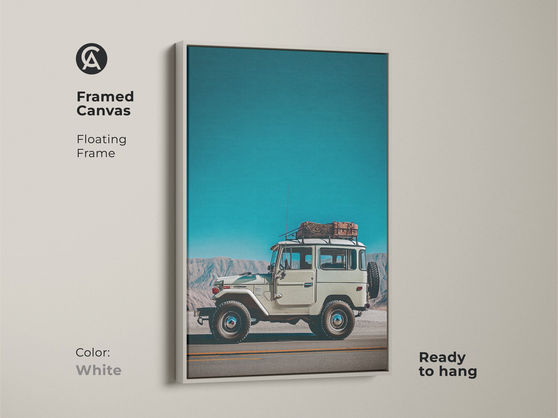 Framed canvas displays a vintage SUV with a white floating frame. This retro mountain landscape artwork is ready to hang. The teal sky blue adventure photography suits an industrial loft.