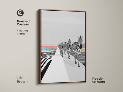 A framed canvas in a brown floating frame on display. The Abstract Zebra Wall Art features a striking graphic style. Black and white zebras are walking amidst a colorful landscape. The eclectic blend of geometric patterns and animal subject creates a unique aesthetic. It's perfect for animal lovers