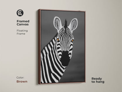 Brown framed canvas showcasing a monochrome zebra. Floating frame complements the minimalist dot style. This African wildlife portrait adds a touch of elegance. A great housewarming gift idea for safari lovers.