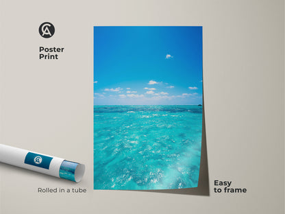 Poster print of a blue sky and turquoise ocean view. The artwork is rolled in a tube for easy framing. This coastal beach wall art is perfect for summer beach wall decor. The nautical home decor print adds a touch of the seaside to any room.