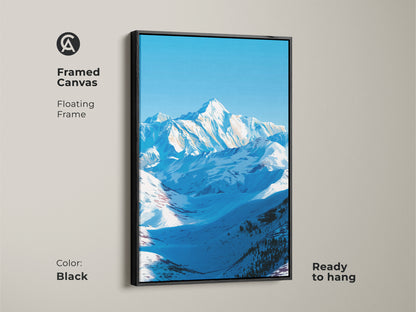 A framed canvas features a floating frame in black showcasing a snowy mountain landscape. This ready-to-hang modern nature artwork brings cool tone wall art to any room. The blue sky mountain art is a perfect piece of bedroom wall decor or home office art. It's a great nature lover gift.