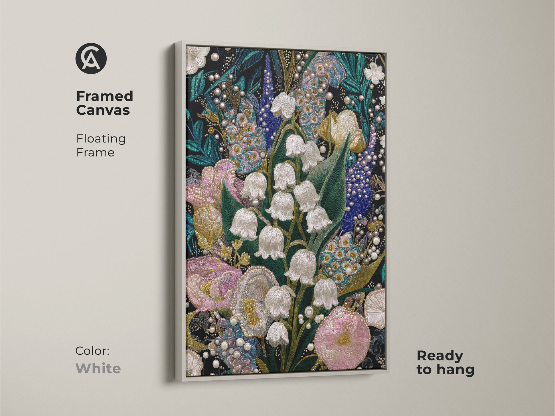 White framed canvas displaying Lily of the Valley & Tulip Embroidery Art. The floating frame highlights the textured floral artwork. Ready to hang this pink teal and white botanical art brings unique artistry to a residential space.