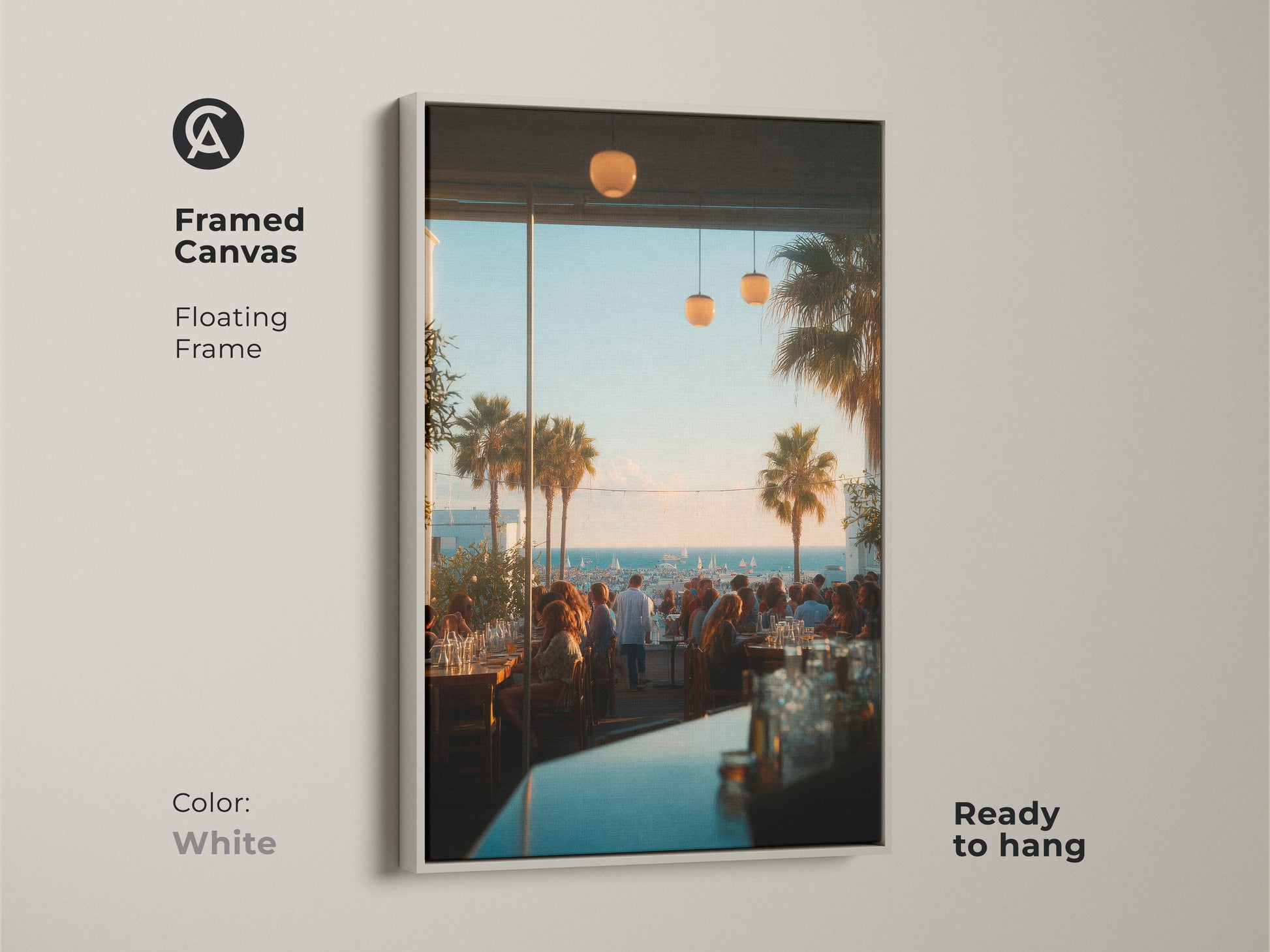 White framed canvas artwork showcasing a lively restaurant scene with a coastal view. The floating frame adds a clean and modern touch. This ready to hang piece brings a fresh ambiance to any space. Ideal for contemporary decor styles.
