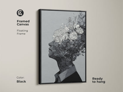 Framed canvas artwork with a floating frame. The art shows a black and white drawing of a floral head. This canvas comes in a black frame. It is ready to hang and will add a touch of elegance to your wall decor.