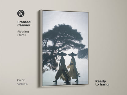 Framed canvas print with silhouetted figures beneath a pine tree. This Japandi wall decor offers a floating frame. This dark blue beige canvas is ready to hang in a white frame. The Asian inspired wall decor is a peaceful nature scene print.