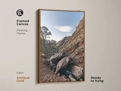 Framed canvas art of a Rocky Mountain landscape with an antique gold floating frame. This rustic wall decor features sky blue nature photography and gnarled trees. Ready to hang this is a perfect hiker gift. Enhance your space with this scenic mountain view.