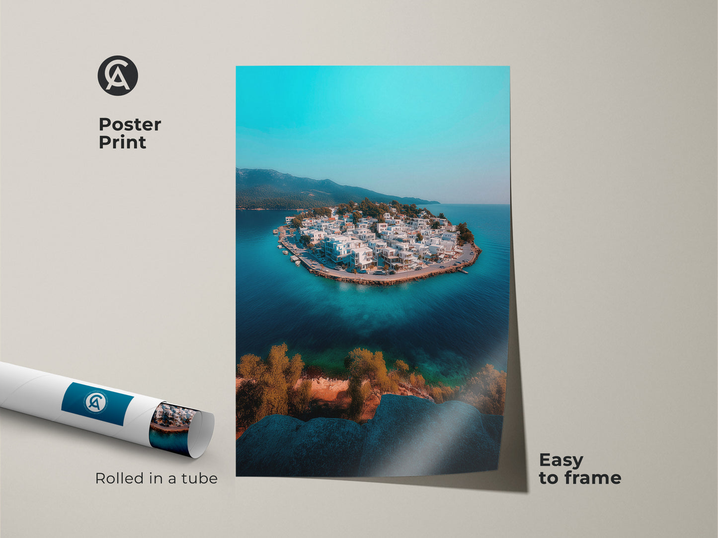 A rolled poster print displays an aerial view of a charming island village with turquoise waters. This museum-quality paper art is easy to frame offering a modern travel-themed aesthetic. Capture the essence of a Mediterranean seaside town with this coastal artwork perfect for a travel lover's collection.