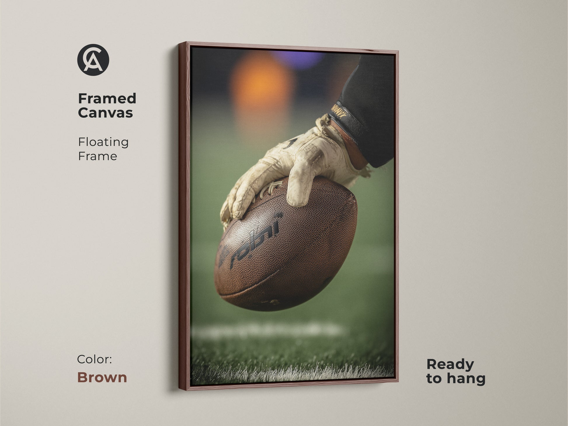 This framed canvas features a close-up of a football player's hand holding the ball. The floating brown frame adds warmth to this sports artwork. Ready to hang this canvas is great for a man cave. This art complements any sports enthusiast's space.