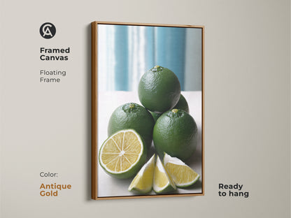 Framed canvas with a floating frame presenting a green lime still life. The antique gold frame adds elegance to this modern minimalist kitchen decor. This botanical citrus fruit artwork is ready to hang.