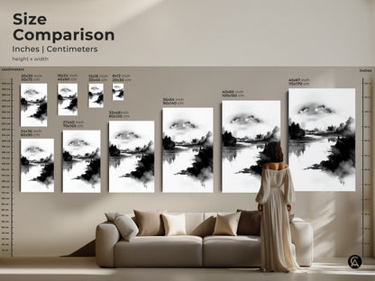 Size comparison of minimalist forest lake art in inches and centimeters. See how the abstract canvas art fits above a sofa. The black and white nature print offers a modern aesthetic. Choose the ideal size for your living room with this serene landscape art. Elevate your home decor with this elegant piece.