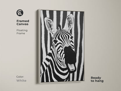 White framed canvas showcasing zebra art. This floating frame accents the black and white zebra against a striped background. Ready to hang this modern animal print brings minimalist wildlife decor to your home. A unique piece for any room.