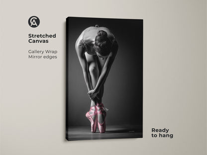 Stretched canvas print of a ballerina. Gallery wrapped with mirrored edges for a seamless look. This art captures a dancer in pink pointe shoes. The canvas is ready to hang and enjoy.
