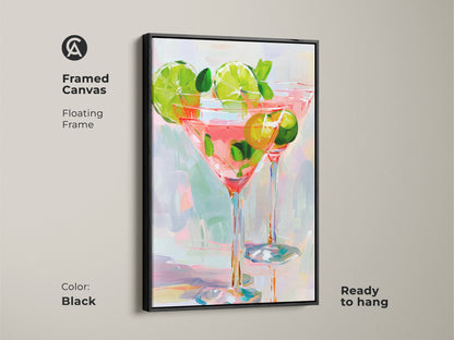 Framed Canvas art. The floating frame is black. It displays two cocktail glasses filled with a pink beverage. Limes and mint garnish the drinks. This ready-to-hang artwork adds a modern touch to your space.