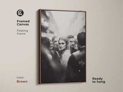 Enhance your space with framed black and white art. This monochrome street photography features a captivating woman's portrait. The brown floating frame adds a touch of warmth. Ready to hang in your bedroom or living room. Perfect for contemporary home decor. The brown frame enhances the urban fine art print.