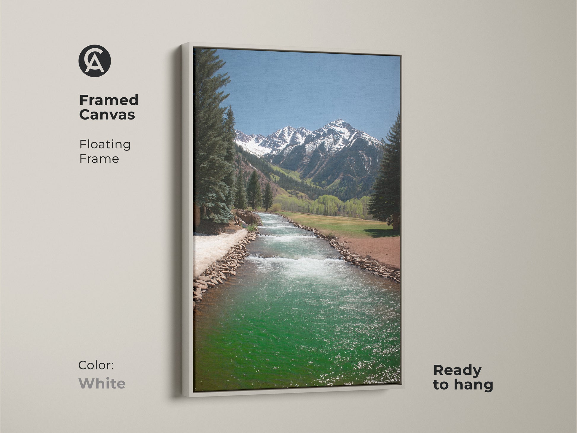 A white floating frame highlights this canvas art of a turquoise river landscape. The rustic mountain scene is a serene nature artwork. Ready to hang this pine tree and mountain print adds a fresh touch to any room. Perfect for a bedroom.