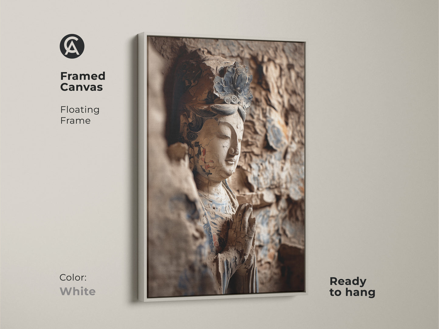 A framed canvas displays a Buddha statue artwork. The floating frame is white. This religious statue print is ready to hang. It's a great addition for buddhism themed art.