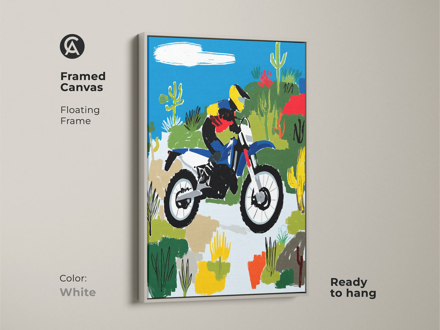 Framed canvas print showcasing a motocross rider in the desert with a white floating frame. The art is ready to hang. Blue yellow and green tones add vibrancy. Perfect for outdoor sports enthusiasts this piece is ideal for wall decor or a garage.